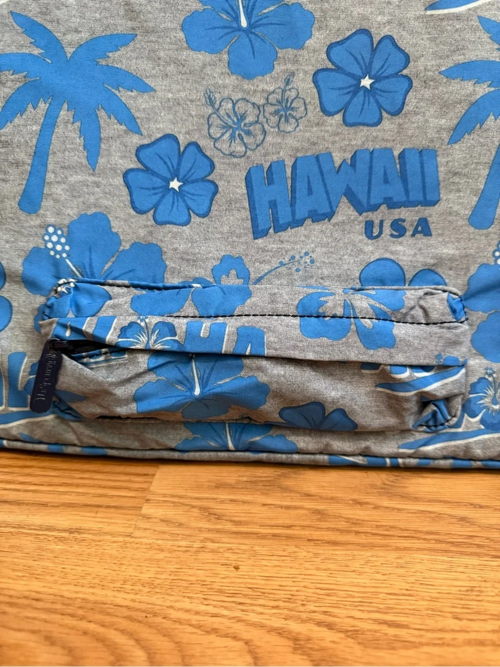 LeSportsac brand travel pouch or laptop case featuring a blue and grey hibiscus